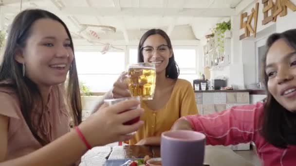 Multicultural People having breakfast drinking coffee and cheers. Happy community fun together in a terrace bar. — Stockvideo