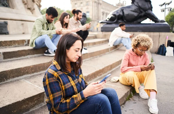 Technology addicts group of people ignoring each other using Mobile. Individualist people chatting with smart phone. High quality photo