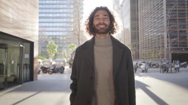 The united community following the leader towards business success. A happy man walks followed by his motivated workers. High quality 4k footage