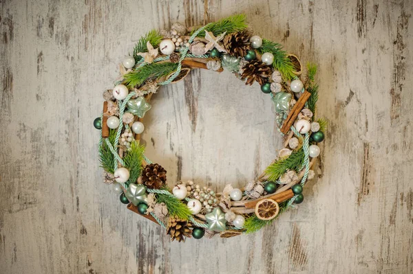 beautiful Christmas wreath decorated with various natural and artificial materials. Top view