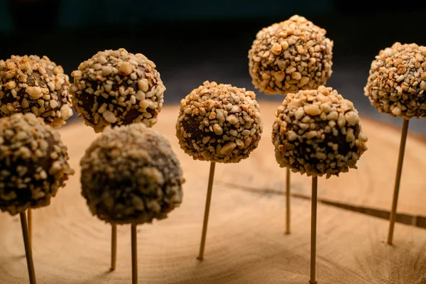Candy bar of chocolate cake pops with nut and golden flakes — 图库照片
