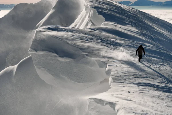 Great view of snow covered mountain slope and man walking on it — Stock Photo, Image