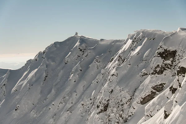 Awesome beautiful aerial view of winter mountain range snow-capped with powder snow — Fotografia de Stock