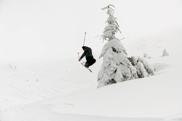Athlete Skier Masterfully Jumping Slopes Snow Capped Mountains Ski Touring Stock Photo
