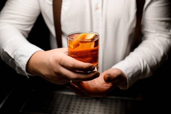 Close Transparent Glass Alcoholic Cocktail Ice Cube Garnishing Orange Zest Stock Photo