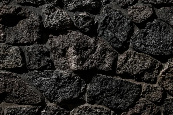 Close Texture Old Stone Wall Dark Grey Rocks Different Shape — Fotografia de Stock