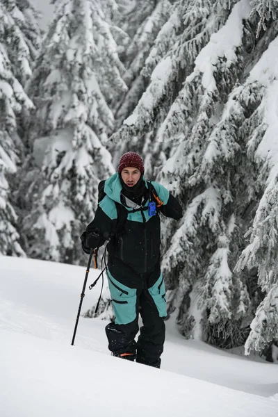 Male Skier Colorful Costume Ski Ski Poles Walking Snow Covered — Stok fotoğraf