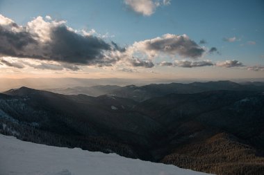 awesome beautiful view of the sky with clouds and a magnificent landscape of the Carpathian mountains in winter