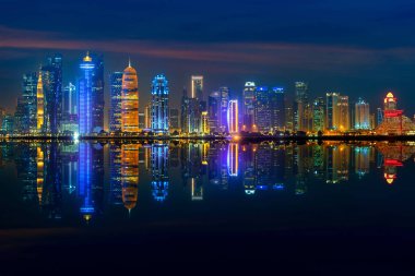 Panoramic skyline of Doha city at night, Qatar.
