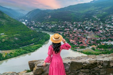 Tourist visiting at Jvari Monastery and Mtskheta city in Georgia.