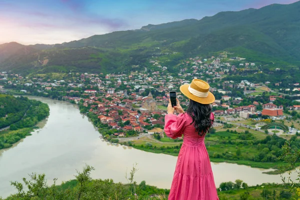 Tourist visiting at Jvari Monastery and Mtskheta city in Georgia.