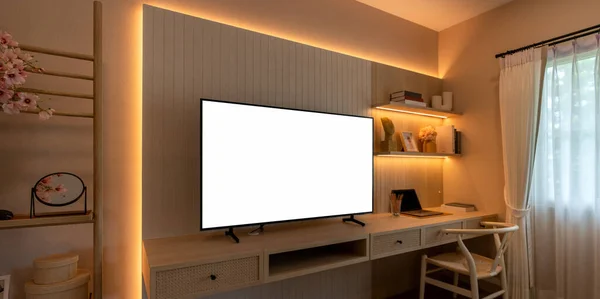 Smart television with white background on tv cabinet.