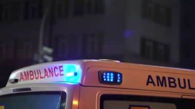 The view of rear doors and flashing lights of ambulance of emergency services