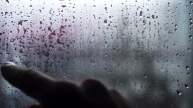 Handwritten inscription in English 911 on frosted fogged glass.
