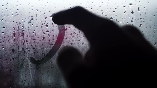 Handwritten inscription in English 911 on frosted fogged glass. — Video