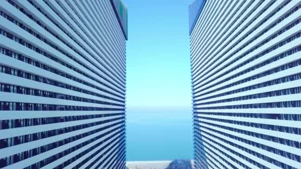 Dron lata między dwoma budynkami ze szklanymi oknami. — Wideo stockowe
