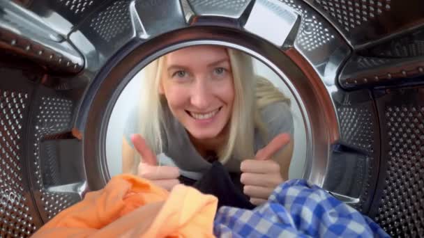 Young Beautiful Woman Doing Laundry Looks Washing Machine Making Normal — стокове відео