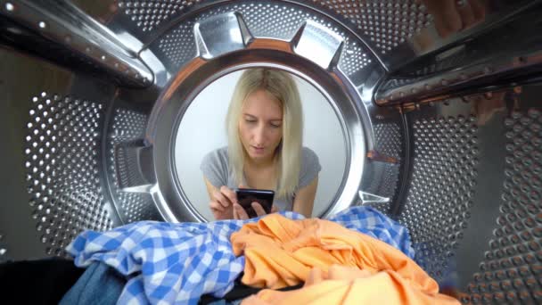 Young Beautiful Slender Caucasian Girl Sits Front Washing Machine Holds — Stock Video