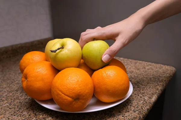 Woman Hand Taking Green Apple Plate Fruit Orange Apples — Stock Photo, Image