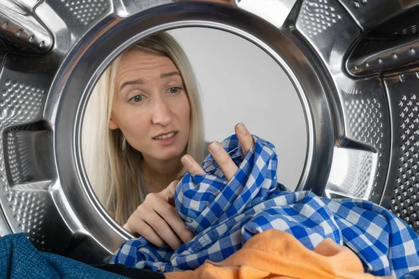 Disgruntled Young Blonde Woman Holds Leaky Shirt Her Hands Washing — Foto de Stock