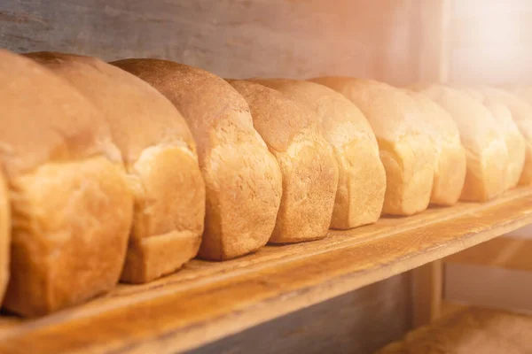 Close Freshly Baked Bread Wooden Shelves Photo Illumination Production Bakery — стоковое фото