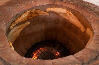 Close-up of Georgian Shoti bread baked in a traditional brick oven torn, tandoor clipart
