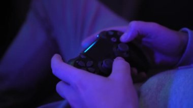 Men's hands holding joystick controller.