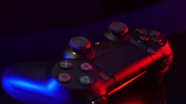 Studio shot. joystick rotates neon light.