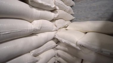 In stock, rice, sugar, cereals and flour are prepared in bags for shipment