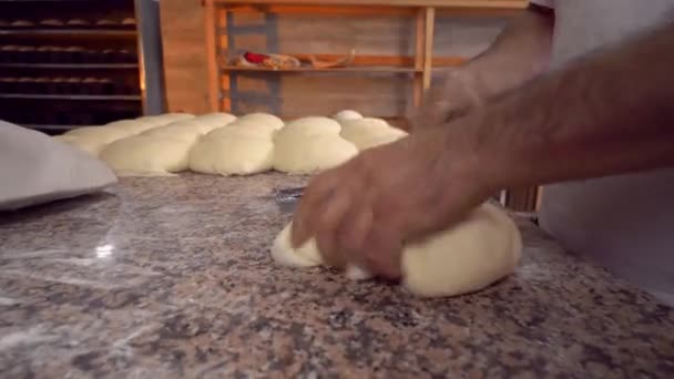 Men's hands hold dough. making raw dough for pizza, rolls or bread. — ストック動画