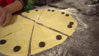 woman twisting pieces and prepare croissant