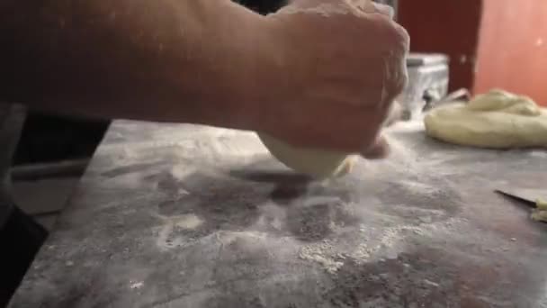 Men's hands hold dough. making raw dough for pizza, rolls or bread. — ストック動画