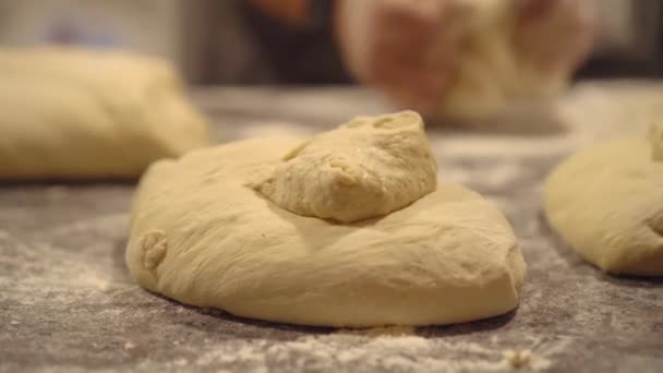 Close-up of finished pink dough in bakery on wooden table. — Stok video