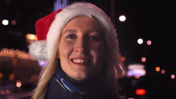 Portrait Woman Makeup Smiling Camera Playing Santa Hat Background City — Stockvideo