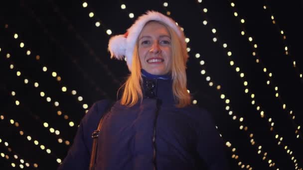 Blonde Curly Haired Woman Celebrates New Year Christmas Santa Hat — Video