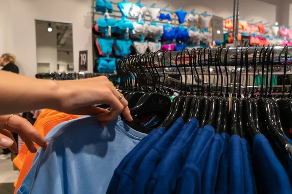 Close Woman Hand Sorting Hangers Sweatshirts Store Selective Focus Women — Foto de Stock