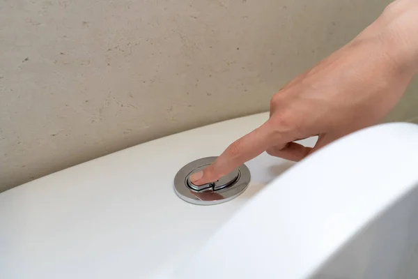 Woman Hand Presses Button White Toilet Flush — Stock Photo, Image