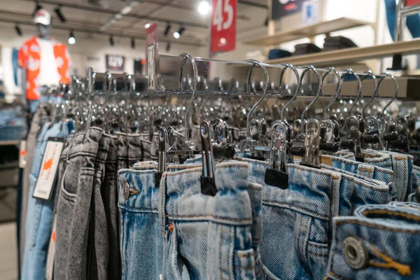 Many Jeans Different Colors Hang Hangers Store Concept Buying Selling — Foto de Stock