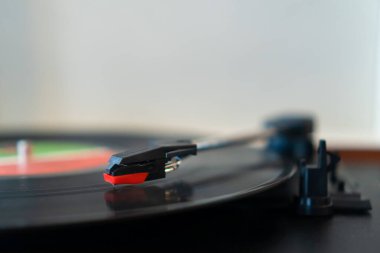Close-up of the gramophone head while playing a vinyl disc. Retro gramophone