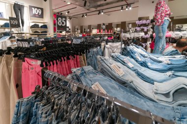 Batumi, Georgia - May 31 2022: Inside the New Yorker clothing store. Fashion store is located in the shopping center. Clothes on hangers or shelves.