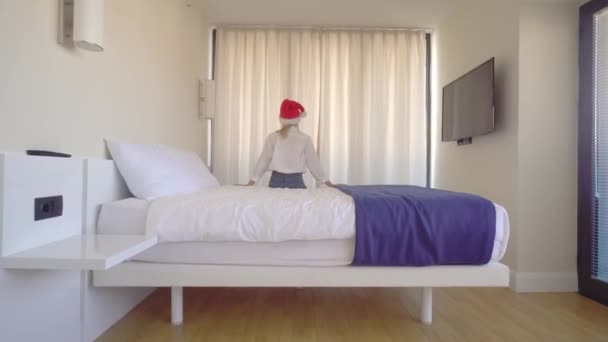 Rear View Woman Santa Claus Hat White Shirt Room Hotel — стоковое видео