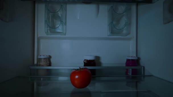 Young Woman Santa Claus Hat Opens Refrigerator Party Looks Tomato — Video Stock