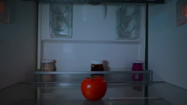 Young Woman Santa Claus Hat Opens Refrigerator Party Looks Tomato — Vídeos de Stock