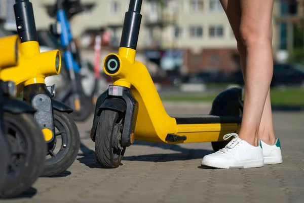 Slender Naked Legs Girl White Sneakers Standing Electric Yellow Scooter — Stockfoto