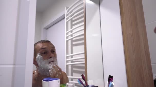 Positive Attractive Young Guy Gel Foam Lower Face Shaving Razor — Stock Video