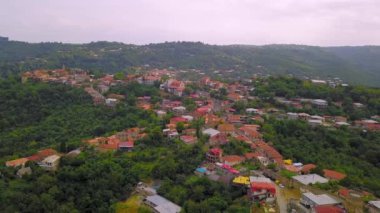 Aerial view of houses in town of Sighnaghi, eastern Georgia Scenic spring view from drone village of Sighnaghi with narrow winding streets located on hill in foothills of Gombori Range, Georgia