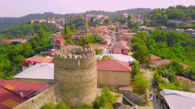 Aerial view of houses in town of Sighnaghi, eastern Georgia Scenic spring view from drone village of Sighnaghi with narrow winding streets located on hill in foothills of Gombori Range, Georgia