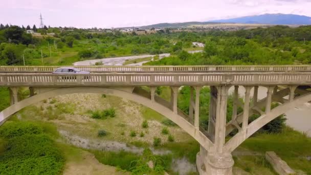 Blue Car Crosses River Old Abandoned Bridge Backdrop Mountains Car — 图库视频影像