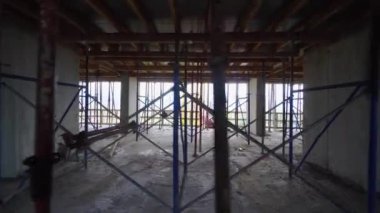 mounts on monolithic structure. Construction concept. Supports of monolithic floor formwork at construction site. Telescopic props for concrete flooring. Construction of modern apartment building