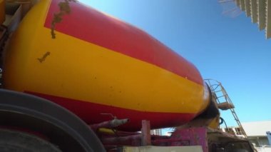 concrete mixer stands on construction site. Motion Camera. Truck brought concrete for pouring monolith to construction site of tall apartment building. Developer as business or contractor.